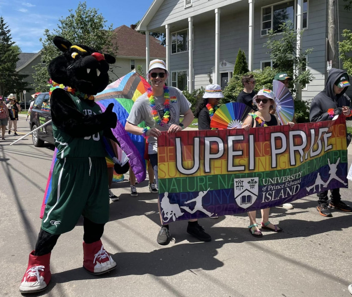 UPEI’s mascot, Pride and members of the UPEI Student Union walk with the UPEI banner in the 2023 Pride Parade in Charlottetown UPEI’s mascot, Pride and members of the UPEI Student Union walk with the UPEI banner in the 2023 Pride Parade in Charlottetown