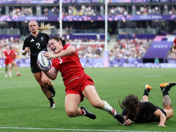 Alysha Corrigan #3 of Team Canada scores her team’s second try while under pressure from Portia Woodman-Wickliffe #11 of Team New Zealand. (Photo by Michael Steele/Getty Images) Alysha Corrigan #3 of Team Canada scores her team’s second try while under pressure from Portia Woodman-Wickliffe #11 of Team New Zealand. (Photo by Michael Steele/Getty Images)