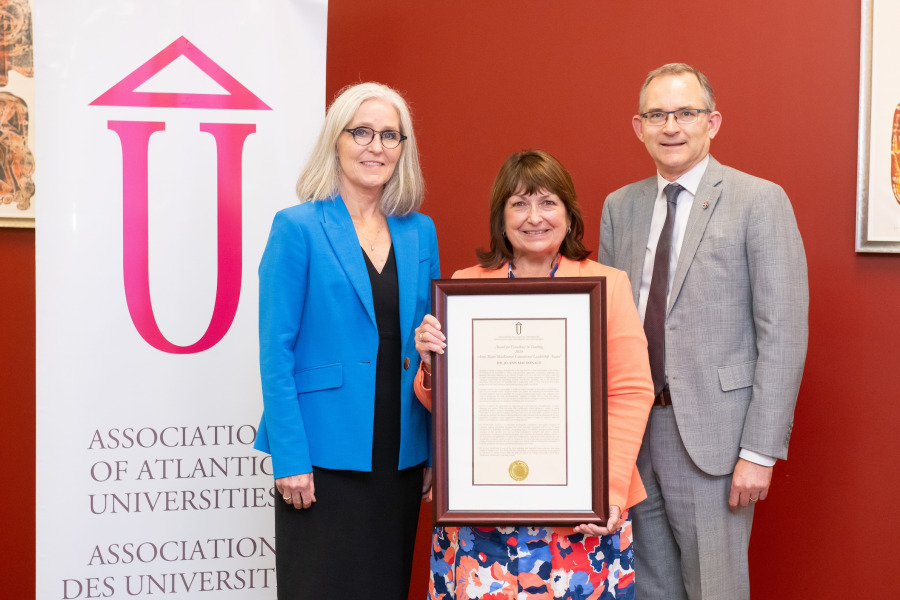 Dr. Wendy Rodgers (left), president and vice-chancellor of UPEI, and Dr. Robert Summerby-Murray, chair of the Association of Atlantic Universities (right), congratulate Dr. Jo-Ann MacDonald, professor in the Faculty of Nursing at UPEI, on winning the AAU’s 2024 Anne Marie MacKinnon Educational Leadership Award. Dr. Wendy Rodgers (left), president and vice-chancellor of UPEI, and Dr. Robert Summerby-Murray, chair of the Association of Atlantic Universities (right), congratulate Dr. Jo-Ann MacDonald, professor in the Faculty of Nursing at UPEI, on winning the AAU’s 2024 Anne Marie MacKinnon Educational Leadership Award.