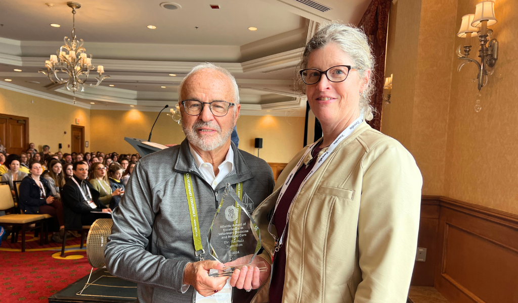 Dr. Rhonda Hamilton (R) receives the Atlantic Award of Excellence from Dr. Ernie Prowse (L), chair of the Atlantic Provinces Veterinary Conference. Dr. Rhonda Hamilton (R) receives the Atlantic Award of Excellence from Dr. Ernie Prowse (L), chair of the Atlantic Provinces Veterinary Conference.