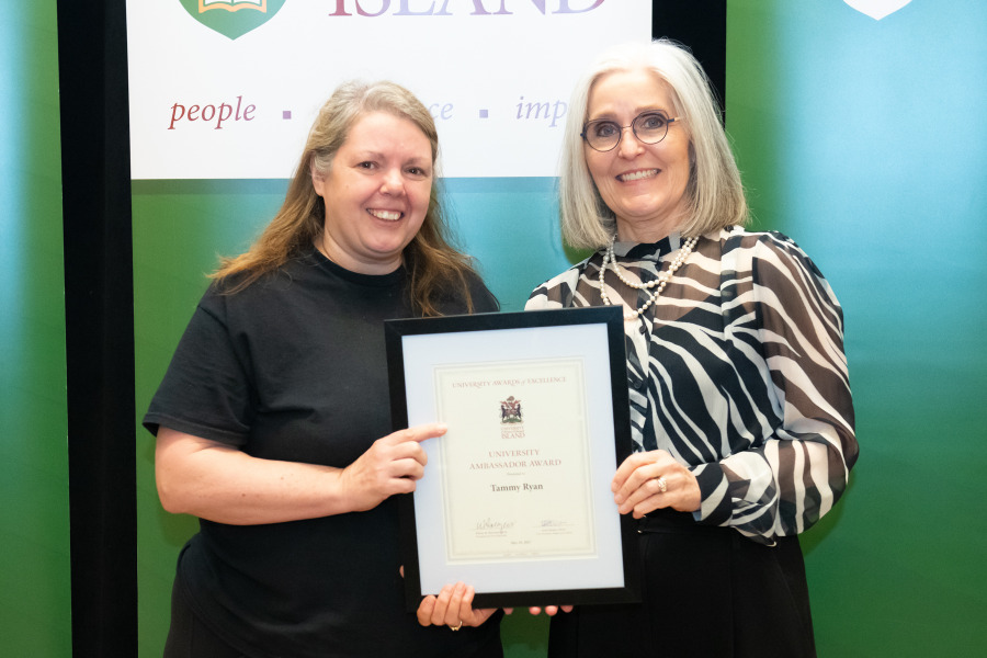 Tammy Ryan, Service Worker with UPEI Facilities Management, accepts the University Ambassador Award from Dr. Wendy Rodgers, UPEI President and Vice-Chancellor. Tammy Ryan, Service Worker with UPEI Facilities Management, accepts the University Ambassador Award from Dr. Wendy Rodgers, UPEI President and Vice-Chancellor.