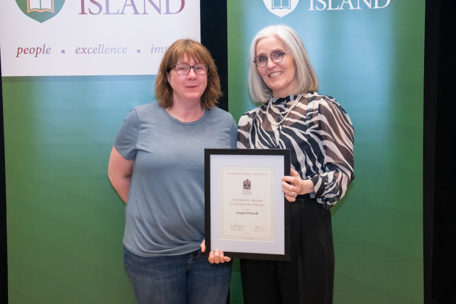 Angela Driscoll receives a University Award for Exemplary Service from Dr. Wendy Rodgers, UPEI President and Vice-Chancellor