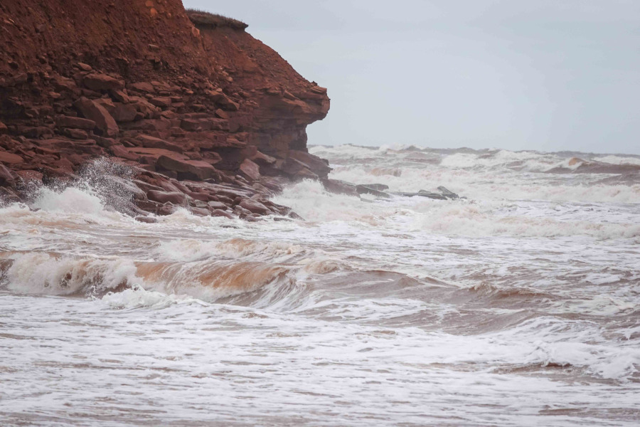 Waves undercut a cliff at Naufrage, PEI. (Photo by Don Jardine) Waves hitting cliff