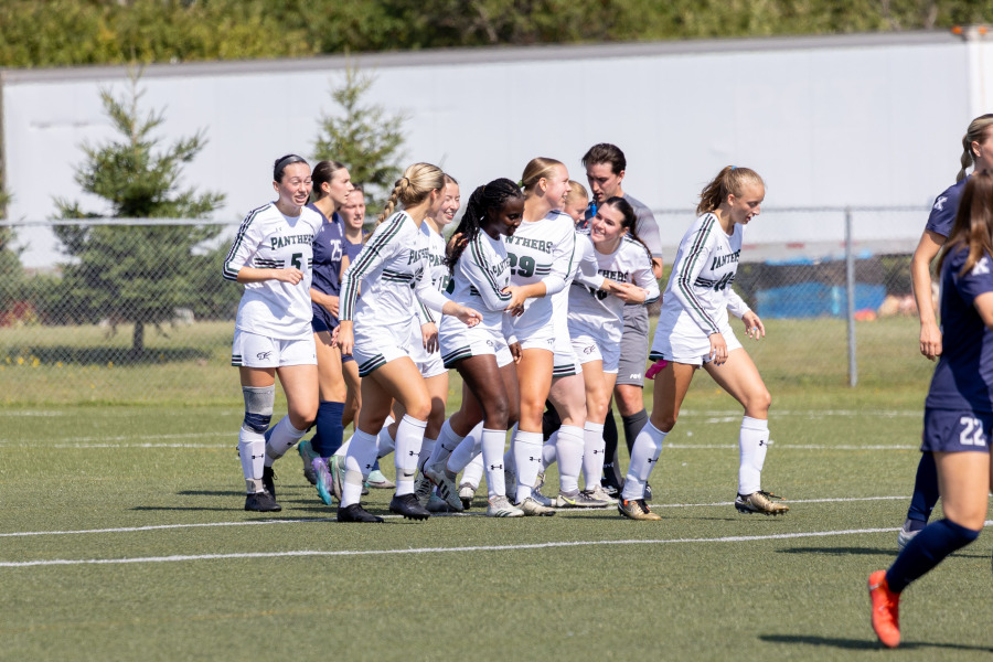 UPEI Women's Soccer players on the field UPEI Women's Soccer