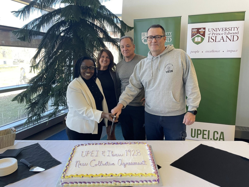 Cutting the cake to celebrate the signing of a new collective agreement between UPEI and IBEW Local 1928 are Dr. Jane Ngobia, UPEI Vice-President, People and Culture; Kelly Drummond, Associate Vice-President, Human Resources; Jim Sponagle, IBEW Local 1928 Business Manager; and Todd MacInnis, IBEW Agent.