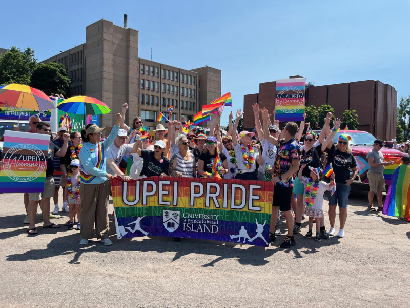 Photo of a group at the Pride Parade wearing colourful clothing