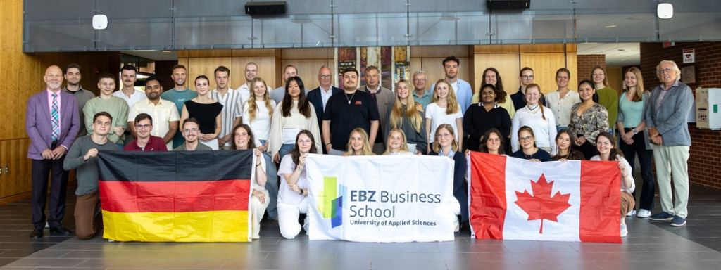 UPEI business professor Dr. Jürgen Krause (left) and Kevin Murphy CM, co-founder of the Murphy Hospitality Group (right) with university students and professors from EBZ Business School in Bochum, Germany, and UPEI.