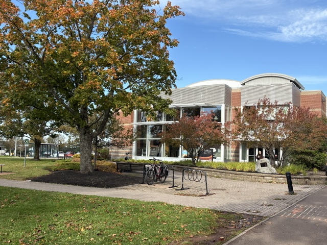 photo of modern campus building during fall