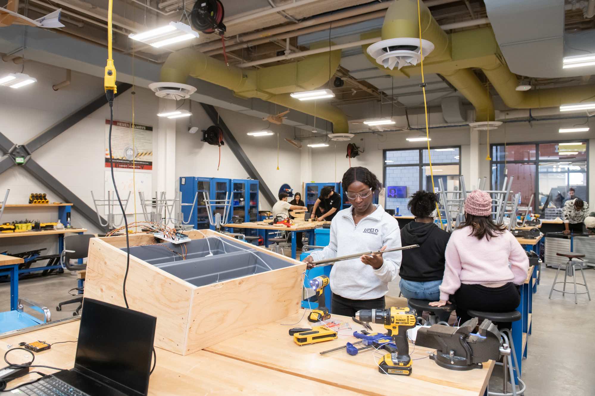 UPEI engineering student Rosetta Shokunbi working on a project in a lab