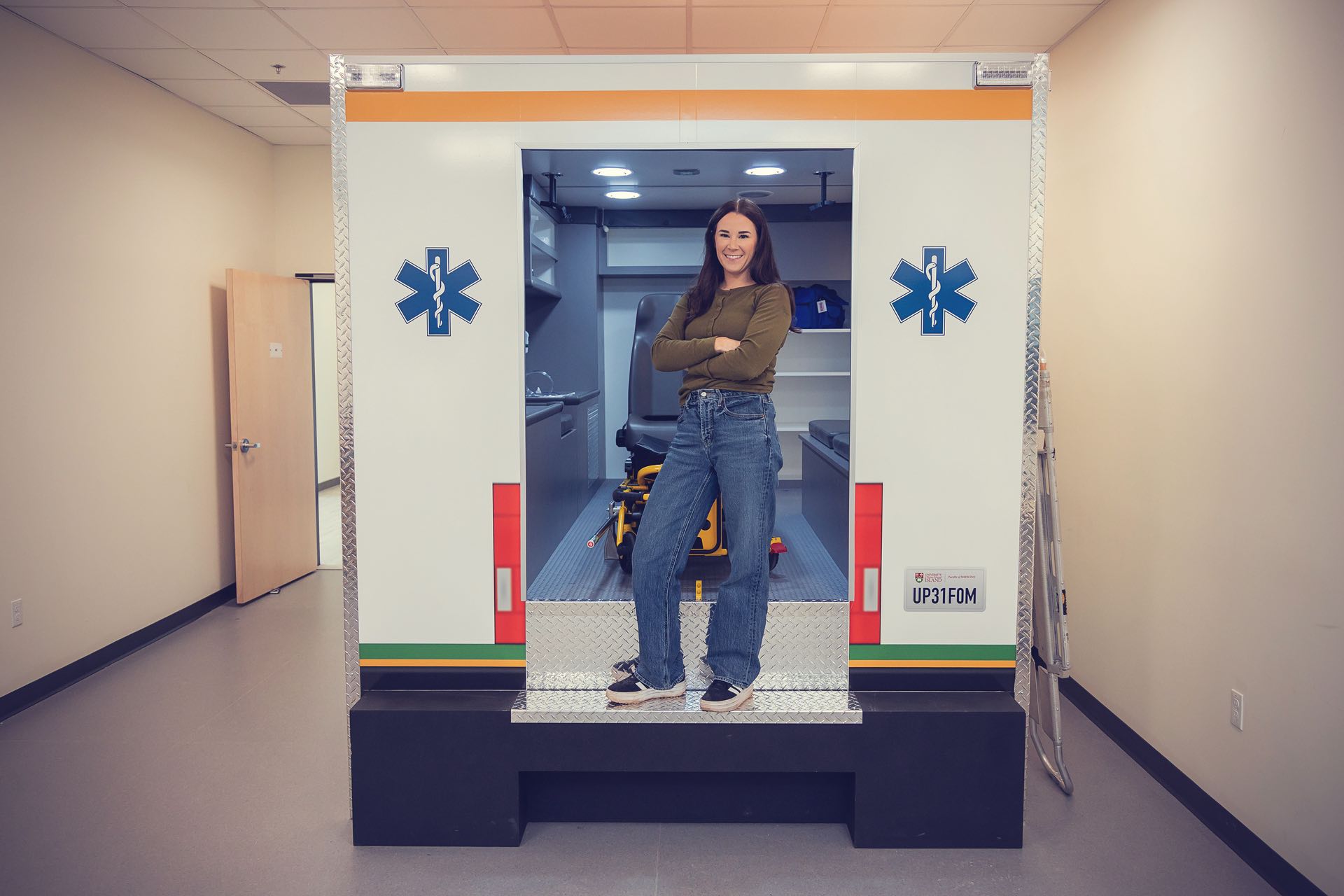 UPEI Paramedicine graduate Kellie MacLeod in a mock ambulance