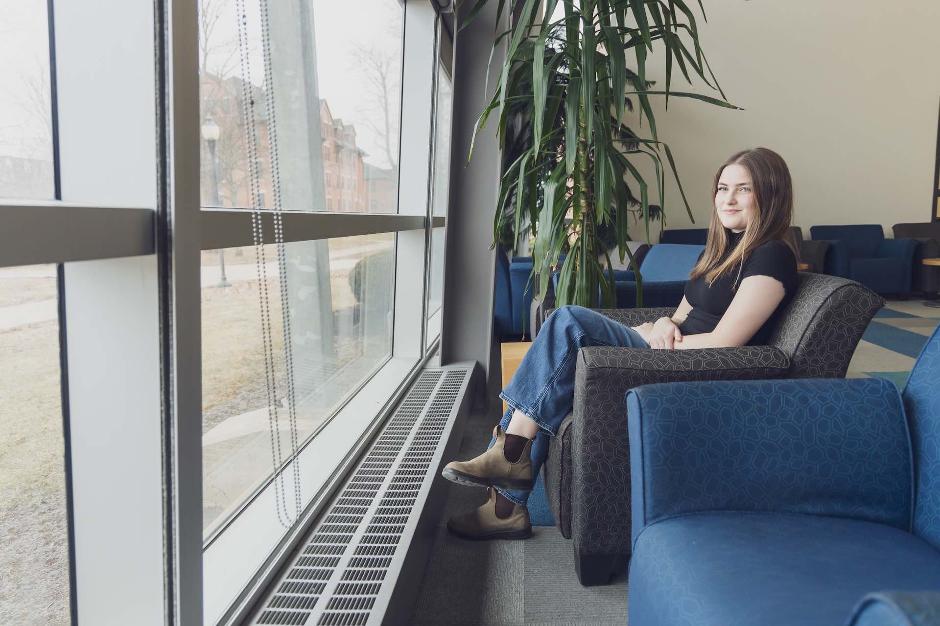UPEI sociology graduate Andraya Gallant in the AVC Learning Commons
