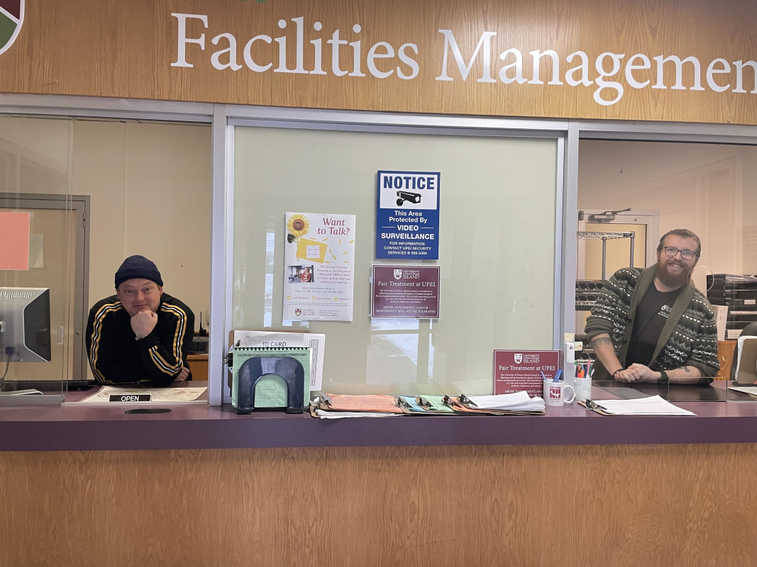 Two men standing at a counter