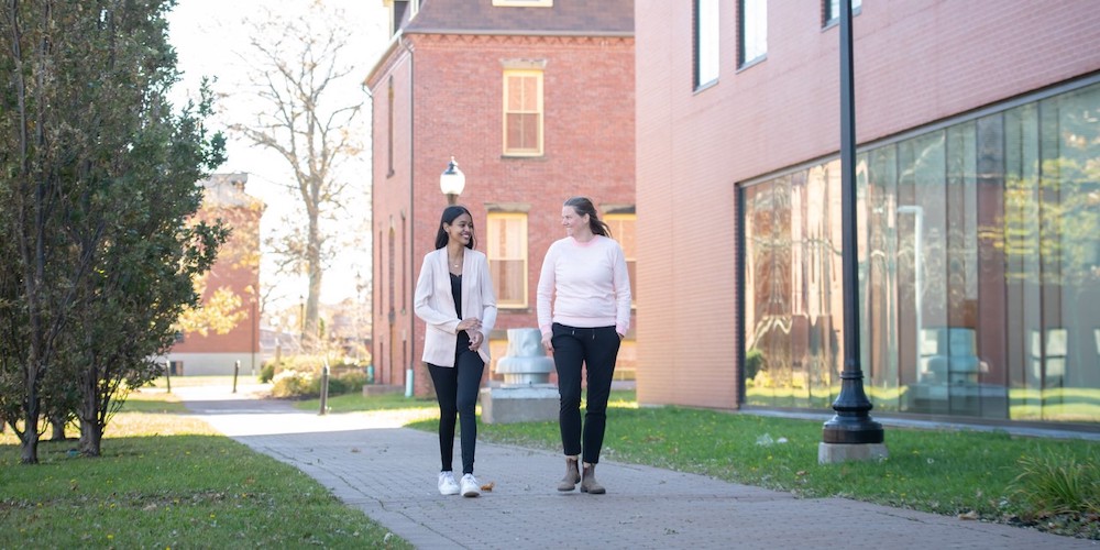 two people walking on UPEI's campus