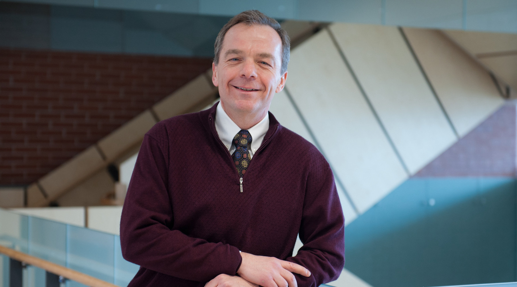 upei professor and researcher bill montelpare standing in health sciences building stairwell in background