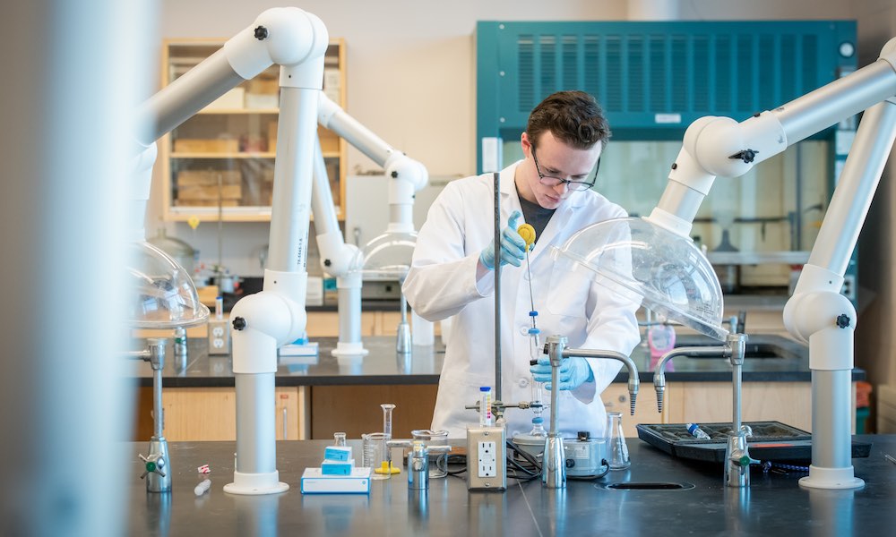 a UPEI chemistry student in a lab
