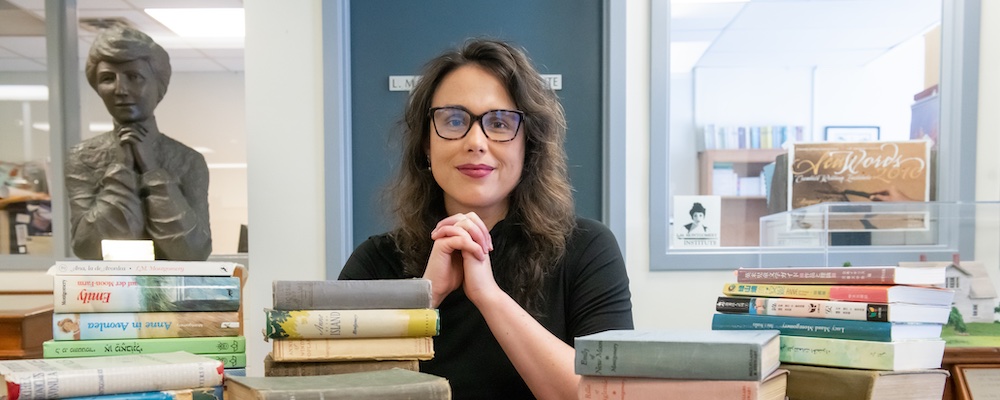 Dr. Kate Scarth sitting with some books