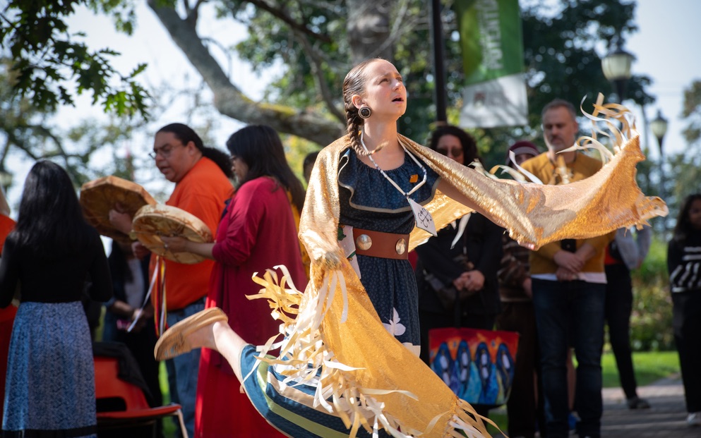 a dancer in Indigenous dress