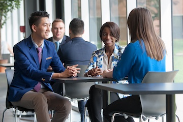 students talking at a table