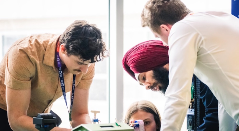 four engineering students working on a project