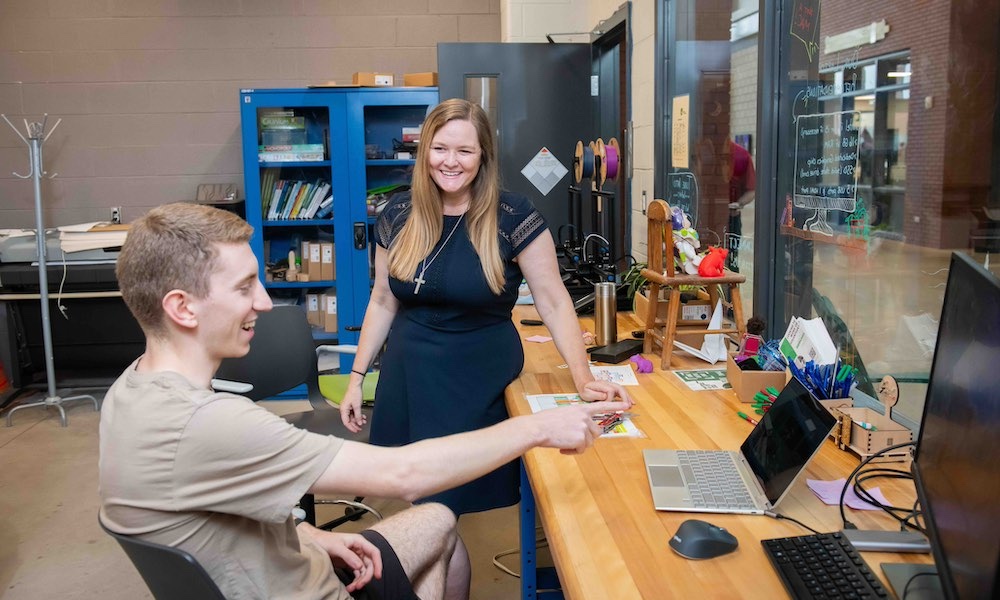 Dr. Libby Osgood working with Engineering student Luke McCarvill