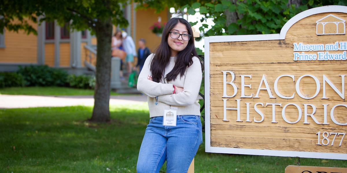 UPEI student Daniela Trinidad Lozano standing in front of Beaconsfield Historic House in Charlottetown
