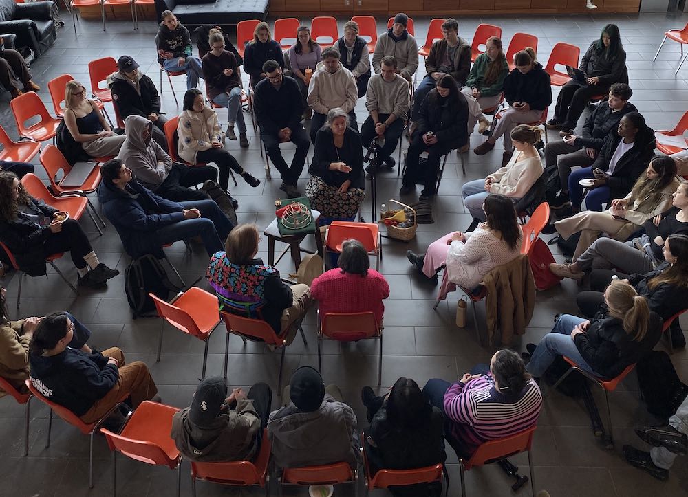 a group learning from an Indigenous Elder