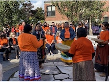 a gathering of people on Orange Shirt Day