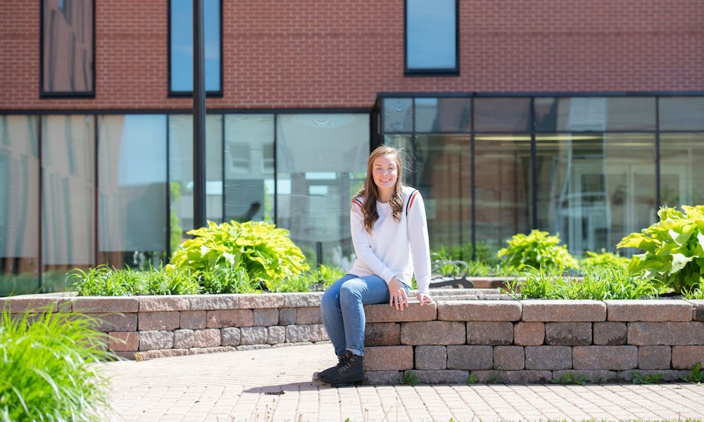 a nursing student outside the UPEI Health Sciences Building