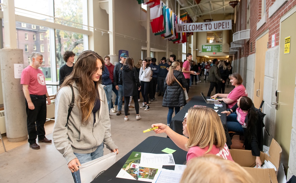 a large group of students in the W. A. Murphy Student Centre breezeway