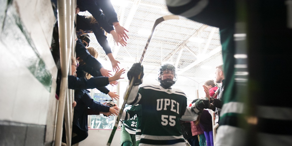 a Panthers hockey player and a crowd