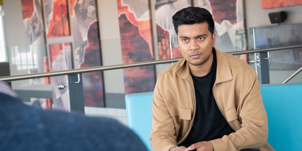 upei engineering student prabhakar bholah sitting in the faculty of sustainable design engineering building