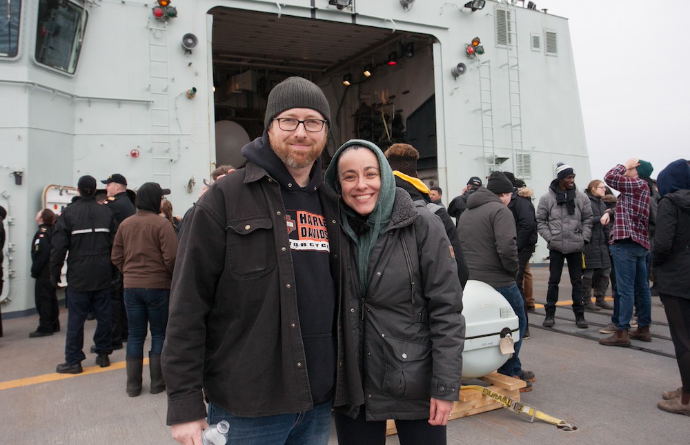 two people standing on the deck of a Canadian naval ship