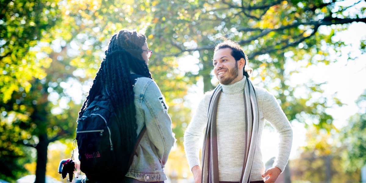 two students talking outdoors