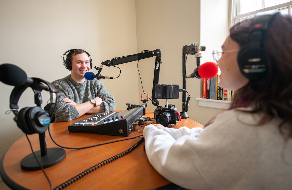 UPEI student Brennan McDuffee interviewing another student during a podcast