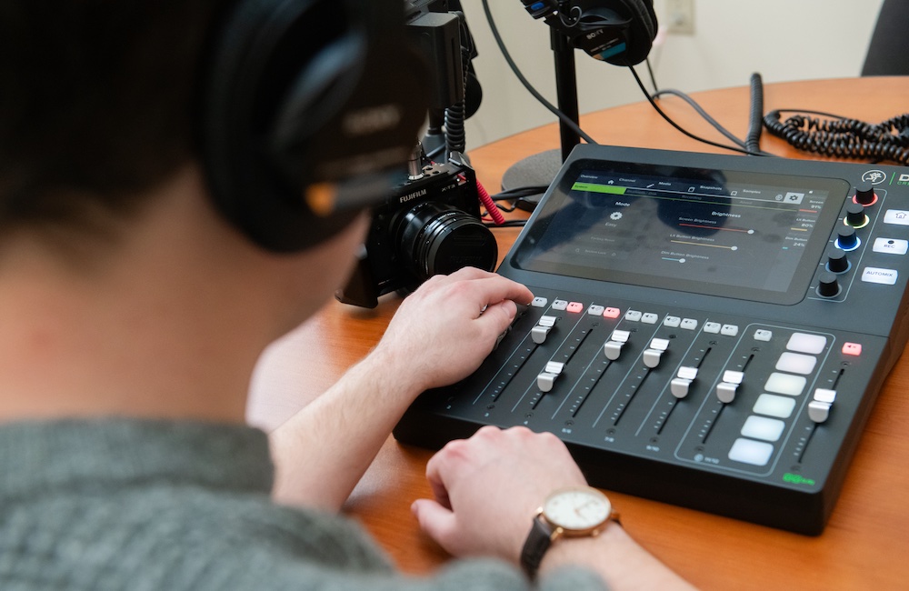 UPEI student Brennan McDuffee interviewing another student during a podcast