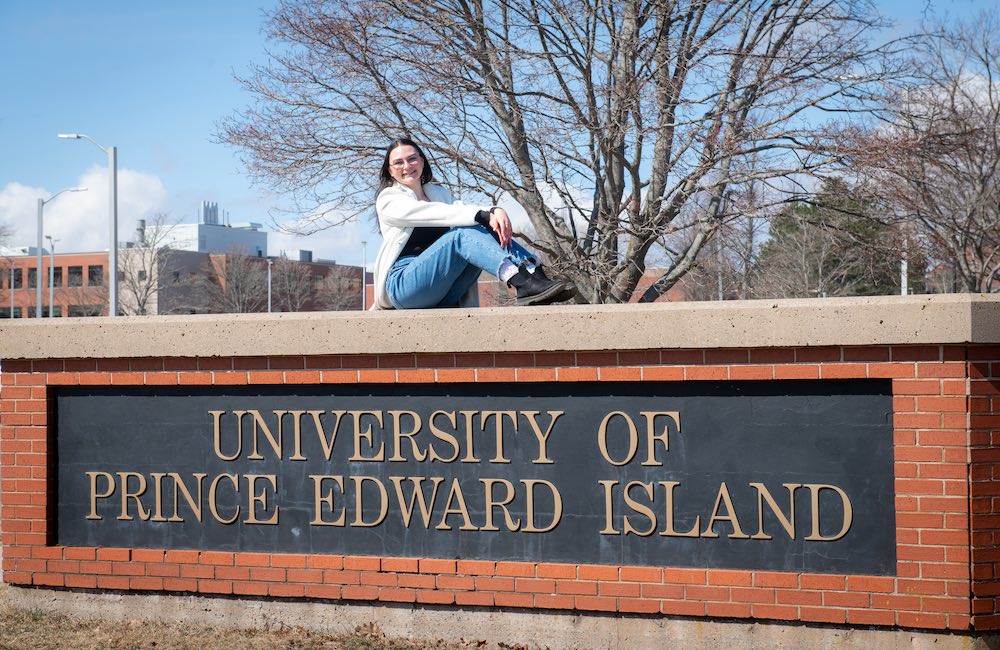 UPEI student Kallie Drummond at the entrance to campus