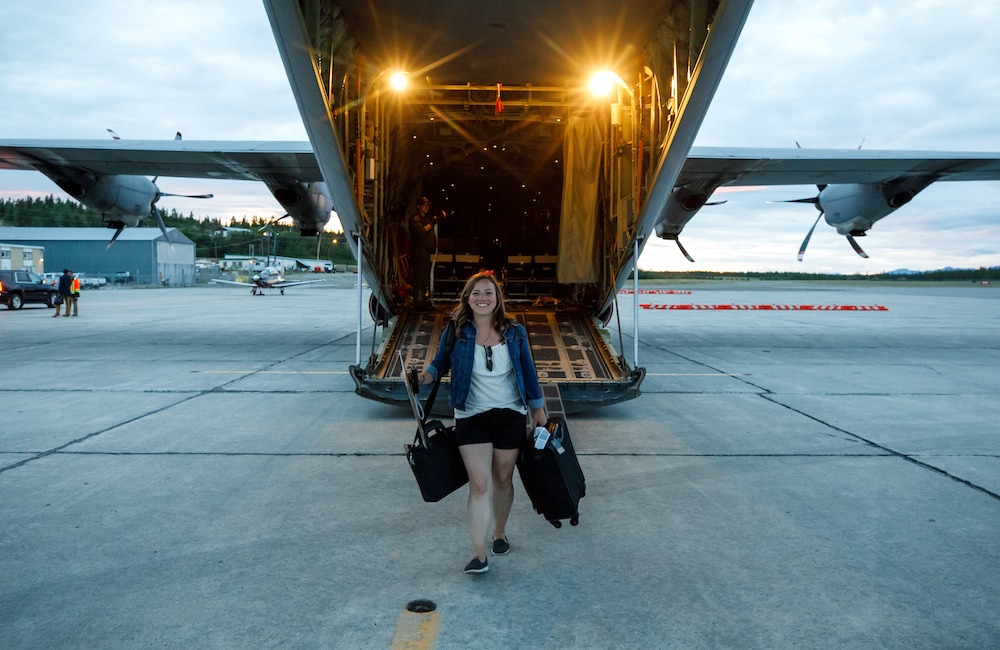 Kate VanGerven stepping off a military airplane