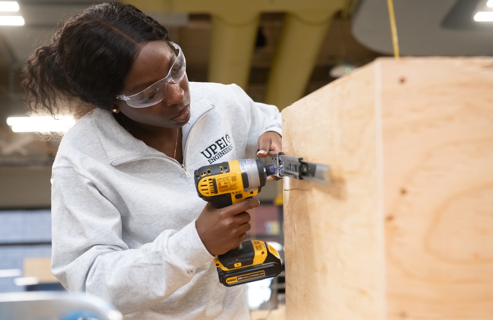 UPEI engineering student Rosetta Shokunbi working on a project in a lab