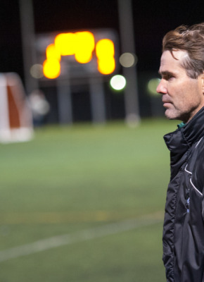 Coach Lewis Page at the 2014-2015 CIS men's soccer championship A man watches soccer
