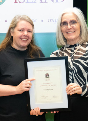 Tammy Ryan, Service Worker with UPEI Facilities Management, accepts the University Ambassador Award from Dr. Wendy Rodgers, UPEI President and Vice-Chancellor.