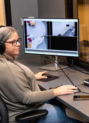 UPEI simulation coordinator Kerie Murphy using a computer