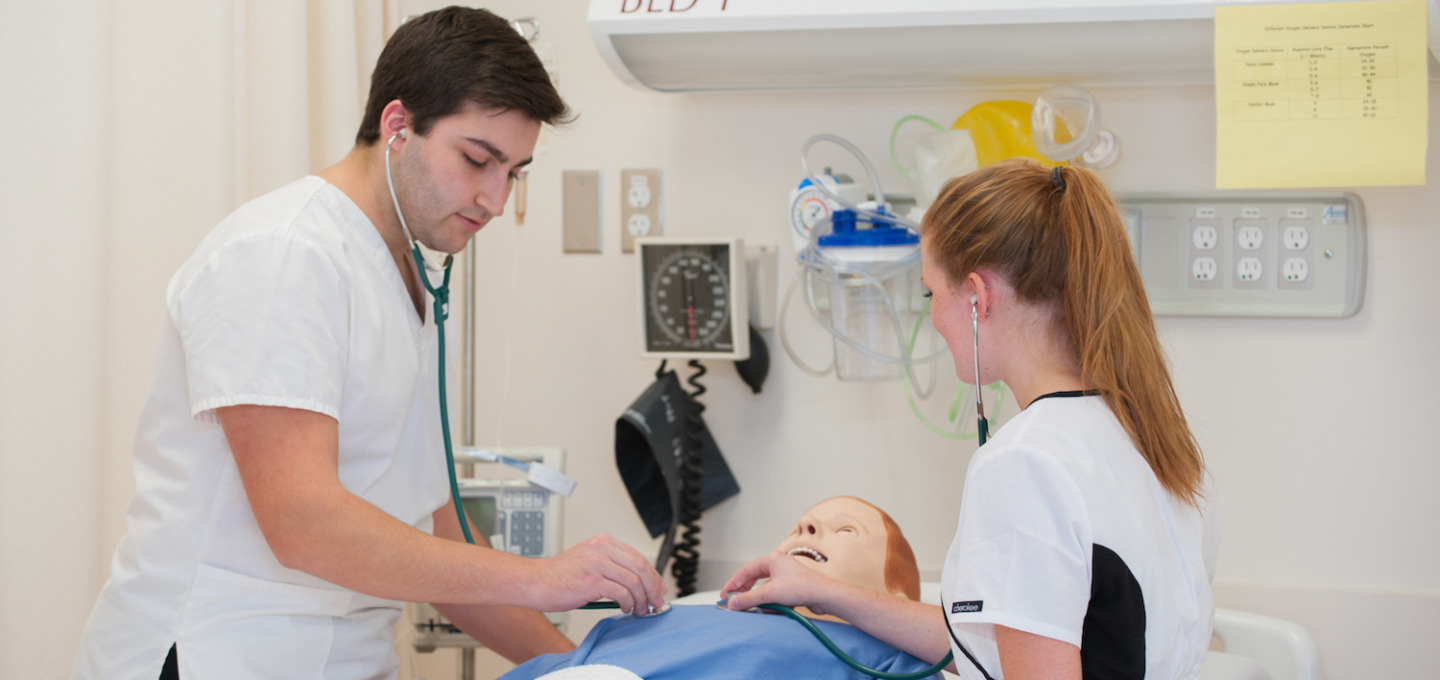 Nursing students practice in lab