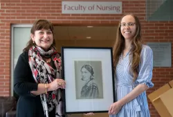Dr. Jo-Ann MacDonald and Katarina McCourt with McCourt's portrait of Florence Nightingale