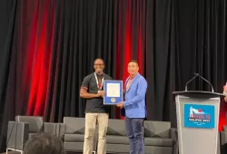 Dr. Dennis Makau receives the Wayne Martin ISVEE Emerging Scientist Award.