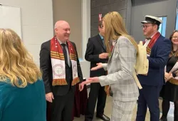 Dr. Greg Keefe, UPEI interim president and vice-chancellor, greets former UPEI Student Union presidents Emma Drake and Will McGuigan at UPEI's 2023 New Year's Day Levee.