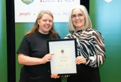 Tammy Ryan, Service Worker with UPEI Facilities Management, accepts the University Ambassador Award from Dr. Wendy Rodgers, UPEI President and Vice-Chancellor.