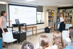 Sherwood Elementary School teachers Jennifer Spencer (left) and Amy Boswall (right) give a presentation to UPEI education students during a Lunch and Learn on June 19.