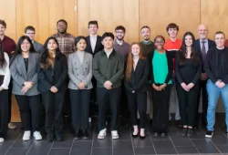Four BUS-3910 student teams with representatives from UPEI Facilities Management, the Transportation and Parking Advisory Committee, and officials from the City of Charlottetown and the provincial government.