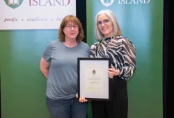 Angela Driscoll receives a University Award for Exemplary Service from Dr. Wendy Rodgers, UPEI President and Vice-Chancellor