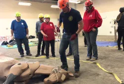 a participant in the TLAER INC course learns how to use an emergency halter